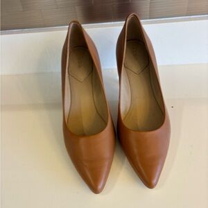 Elegant Tan Leather Pumps colors like a caramel. 8 1/2 but they are true eight